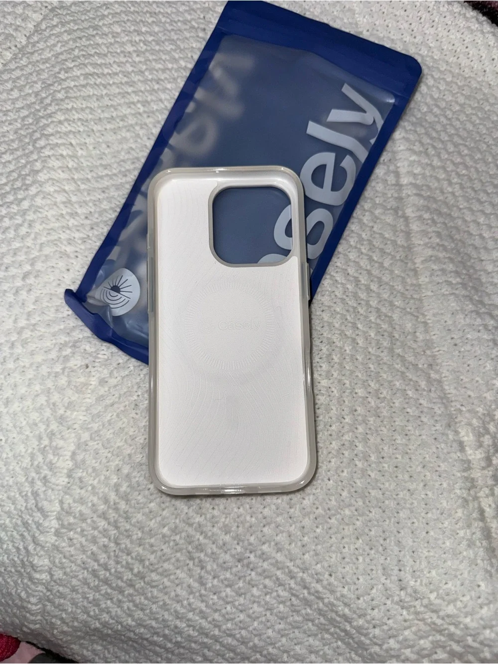 Casetify Cream Phone Case with Blue Ribbon Graphic